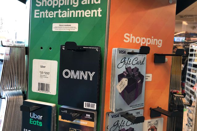 A display carousel of various gift cards, including for MGM Grand, Uber Eats, Visa, and OMNY